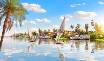 Sailboats in the Nile and the view of Luxor, Egypt