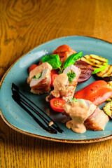 Fried pork rolls stuffed with prunes, wrapped in bacon,