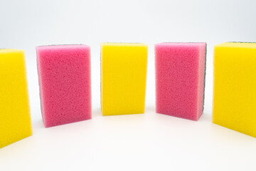 Colorful cleaning sponges isolated on white background