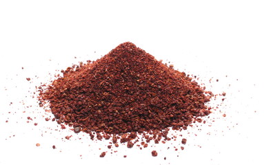 Ground sumac spice, pile isolated on white 