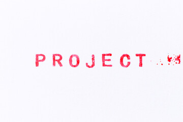 Red color ink rubber stamp in word project on white paper background