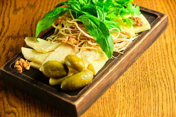 rye bruschetta with honey pumpkin and goat cheese on a dark wood background. tinting. selective focus on mint on the front bruschetta