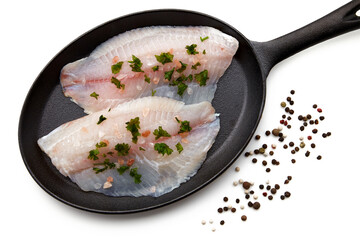 White fish fillet, sprinkled with coarse pink salt and parsley