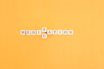 Changing the word made up of cubes with letters, turning Medication word into Meditation