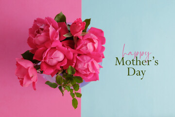 Happy Mothers Day card background for holiday greeting with top view of pink roses.