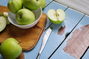 Fresh raw green apples on the wooden background. Healthy food. Juicy fruits for all