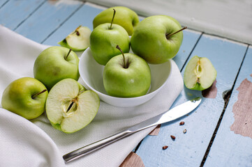 Fresh raw green apples on the wooden background. Healthy food. Juicy fruits for all