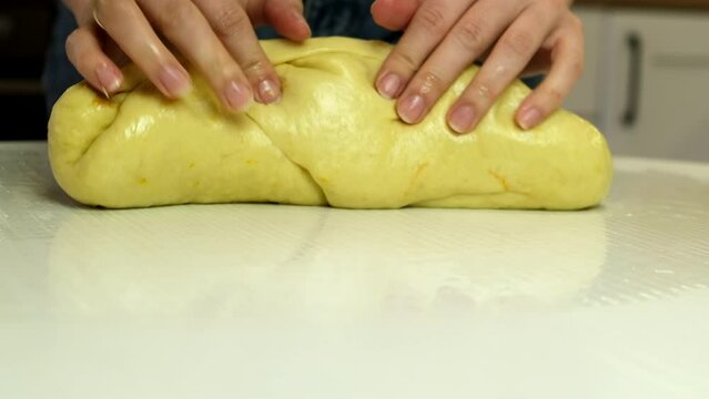 woman hands close up knead the dough