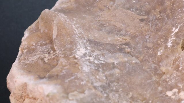 Prehistoric flint stone macro shot with rotating motion, very close up view. Studio quality 4k science video.