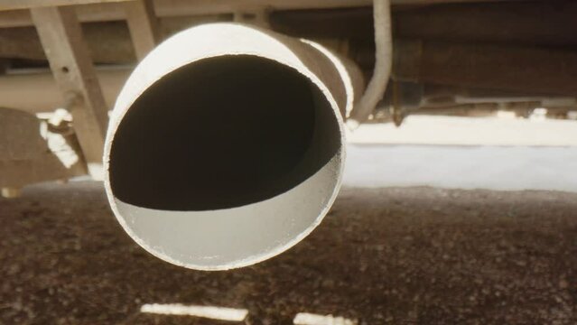 TRACKING PROBE LENS enters a dirty truck exhaust, sunny day
