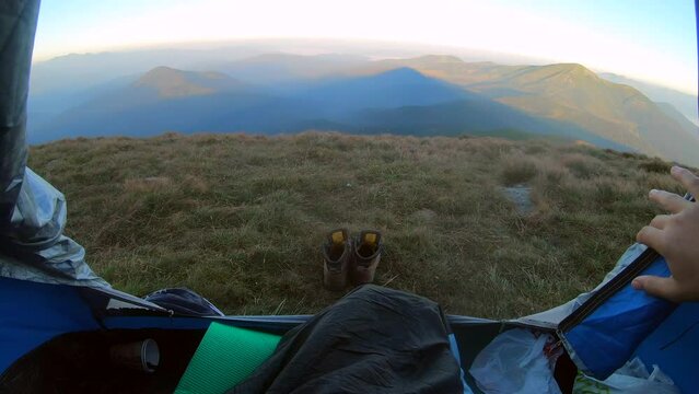 The best view from the tent. dawn on the top of the mountain. best morning in a tent. top of hoverla mountain. Ukrainian mountains. 