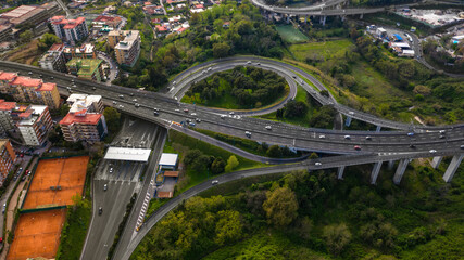 Aerial view of the ring road of Naples, Italy, near the Vomero exit. Many cars travel on the motorway junction. - obrazy, fototapety, plakaty