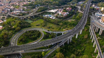 Aerial view of the ring road of Naples, Italy, near the Vomero exit. Many cars travel on the...
