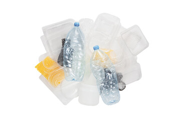 A pile of plastic garbage, top view - plastic water bottles, takeaway food packages, cans, bags, a protective volumetric net for fruits. Isolated. Single use plastic objects.