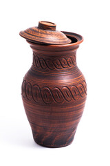 Clay jug with a lid on a white background