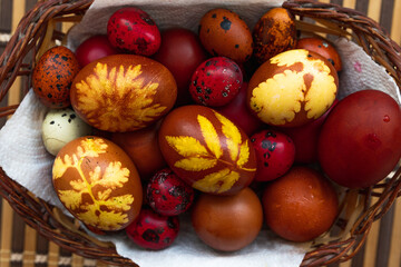 easter eggs in basket. Colored pasta eggs. Red eggs. Traditional Easter eggs.
