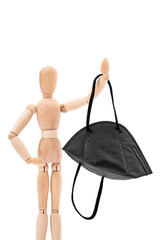 Wooden mannequin holding black N95 medical mask