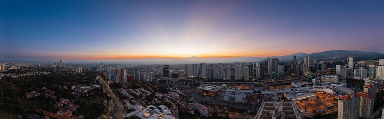 Naklejka premium Panoramic aerial photography of Mexico City at sunrise from the area of buildings in Santa Fe with the volcanoes in the background