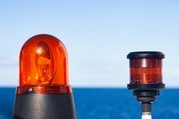 Marine signal light and emergency signal lamp off during the day, against the backdrop of the sea...