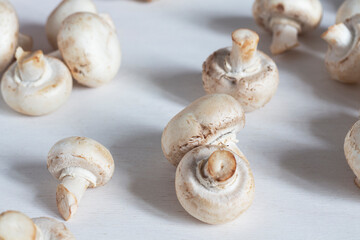 Fresh natural champignon mushrooms on the table