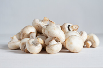 Bunch of fresh white champignons on the table