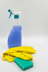 Set of various bright cleaning items, bottles, utensils, supplies. Home cleaning, housekeeping concept.