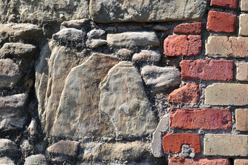 Close Up of Grey Stone Rocks Set in Old Brick Wall