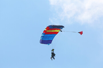 Skydiver flying wing in a blue sky	
