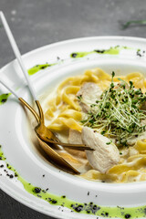 Pasta alfredo with chicken, Fettuccine alfredo in a creamy sauce with chicken, parmesan on white plate. Italian cuisine. Restaurant menu, dieting, cookbook recipe top view