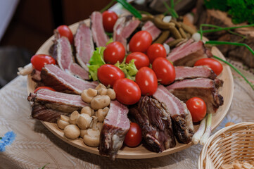 Slicing different types of meat. Meat snacks on the table. wedding buffet. Catering