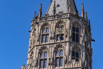 Obraz premium Architectural details of medieval Cologne Town Hall (Rathaus Koln) - XV century Gothic style tower. Cologne, North Rhine Westphalia, Germany.