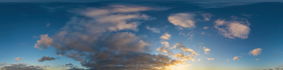 Panorama of a dark blue sunset sky with golden Cumulus clouds. Seamless hdr 360 panorama in spherical equiangular format. Full zenith for 3D visualization, sky replacement for aerial drone panoramas.