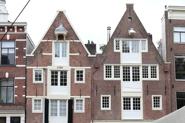 Fototapeta na wymiar Amsterdam Herengracht Historic Brick House Facades with Spout Gables, Netherlands