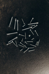 Sharp screws on a black background