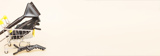 various hairdressing tools with shopping cart on a beige background. beauty salon concept