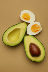 Fresh and tasty avocado and halves of boiled egg