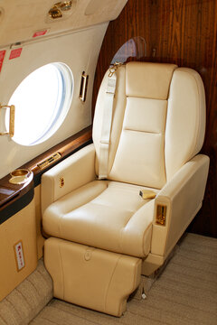 Private jet interior, leather armchairs