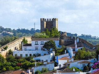 Obidos, Portugal.  View of the town, the medieval walls, and historic houses