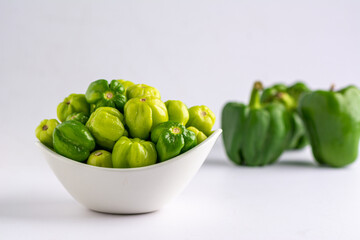 Close up shot of green peppers, with green bell peppers