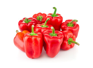 Red ripe peppers close up on white background