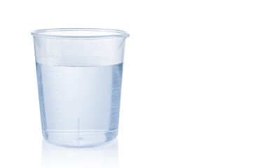 Measuring plastic cup with water isolated on white background