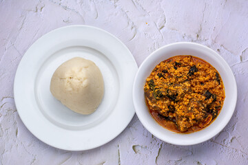 Top shot of served Egusi soup and fufu or pounded yam
