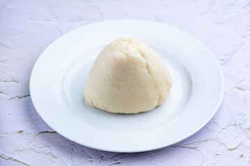 A close up plate of pounded yam or fufu