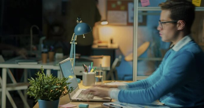 Time lapse portrait of hard-working employee busy with laptop all night then sleeping at desk in empty office. Job and entrepreneurs concept.