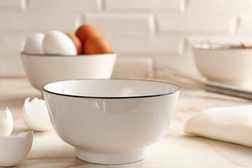 Cooking in the kitchen. White and brown eggs. Preparing breakfast. selective focus