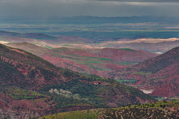 View over the High Atlas Mountains in Morocco with rainy sky. Valley of the roses