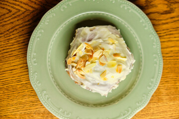 Pavlova meringue cake decorated with whipped cream and blueberries