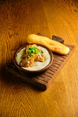 Butadon, Japanese rice bowl dish consisting of bowl of rice topped with pork belly simmered surved with with Japanese oden soup.