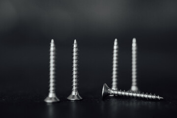 Closeup shot of nails, drill screws