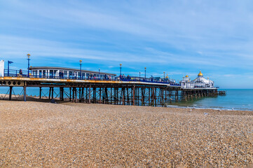 A view looking down the length of the pier at Eastbourne, UK in springtime